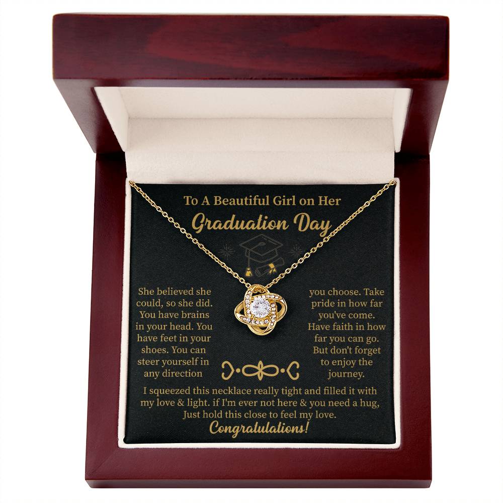 graduation necklace displayed with a heartfelt message card for daughter